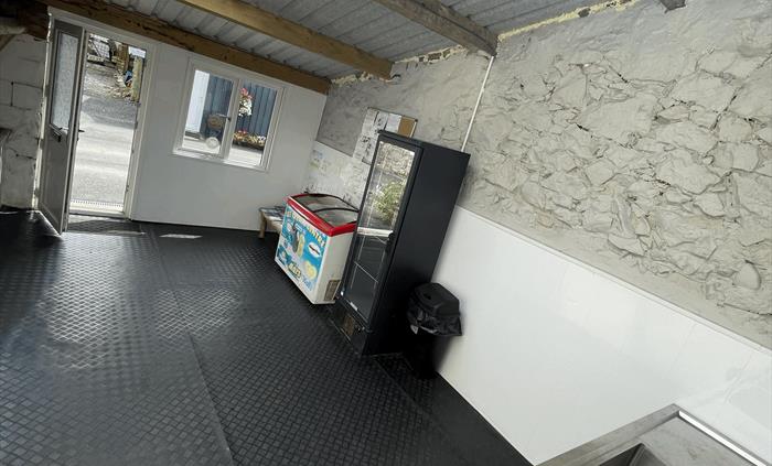 communal area with double sink, fridge and freezer